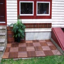 Quick concrete patio transformation with Ipe Wood Deck Tiles from AdvantageLumber.com