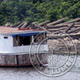 <strong>BRAZIL<br /> 9:25 am</strong><br />Here, In the forground we see a Brazilian boat, and in the background we see fresh cut trees waiting to get milled.